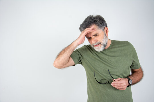 Unhealthy man feel stressed suffer from migraine or headache at home. 