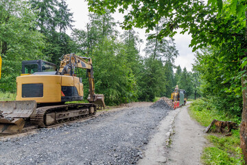 Road Construction with Excavator in Forest