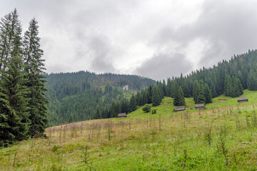 Scenic View of Mountain Slope and Shepherd Cabins