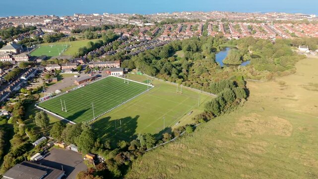 Whitley Bay Rockcliff RFC flover drone view. The coast is visible in the background panorama