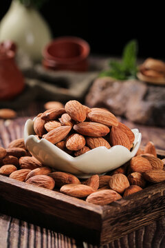Fresh Raw Almonds in Bowl on Wooden Tray - Healthy Nuts and Baking Ingredients