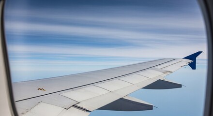 Obraz premium Airplane wing flying through clouds with copy space