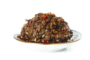 Obraz premium Yunnan Spicy Stewed Chili Dish on White Plate
