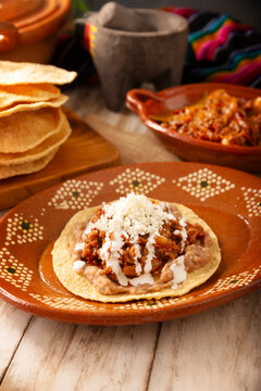 Tinga toast, a traditional Mexican home-cooked dish consisting primarily of beef cooked with chipotle chili and lots of onion, is traditionally eaten on "Tostadas" (fried corn tortillas).