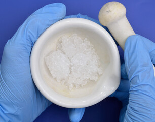 Cadmium nitrate powder on beige background