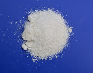 Sodium diethyldithiocarbamate powder on the light gray background