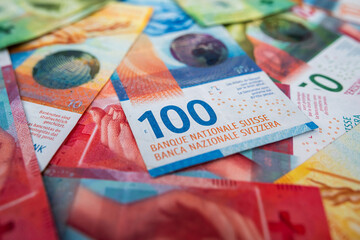 Swiss franc banknotes background representing strong currency, banking reliability and economy