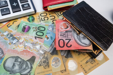Close up of AUD Currency Cash and Calculator for Personal Finance Management and Savings Strategy