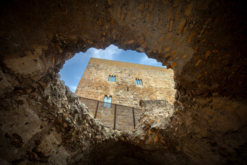 Praetor Tower seen through a hole in the ruins of the Roman circus of Tarragona, Catalonia, Spain © AntonioLopez