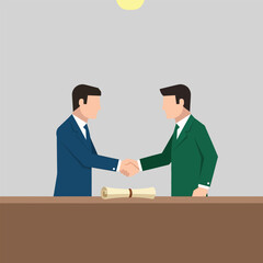 Fototapeta premium Two businessmen in suits shaking hands over a desk with a rolled-up diploma, symbolizing agreement or partnership.