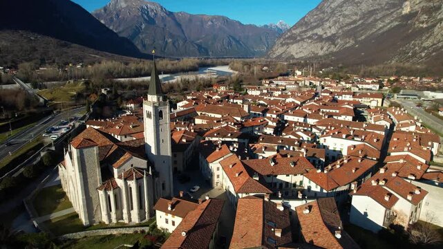 4k drone of Venzone One of the Most Beautiful Villages of Italy with Historic Stone Architecture and Medieval City Walls under Julian Alps Peaks Friuli Venezia Giulia Autumn Alpine Landscape Italy