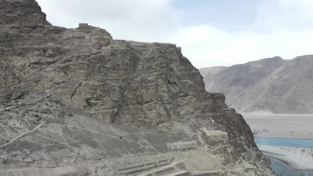 An aerial Shot of Kharphocho fort located in Skardu, its an aerial clip, 4k vieo, drone rising towards the fort and gaining altitude. 