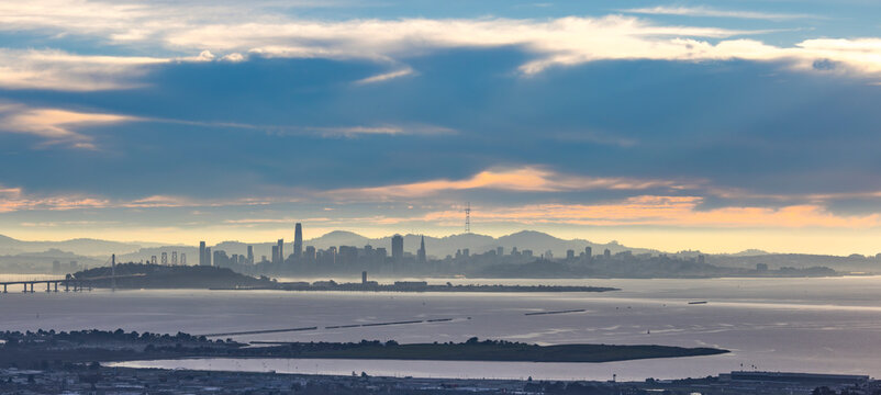 Pastel San Francisco Skyline, Treasure Island, Bay Bridge seen across the bay from Berkeley Hills through very light fog