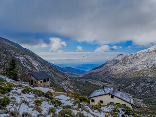 Scenic winter landscape in Serra da Estrela mountains with snow and cloudy sky
