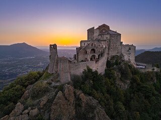Obraz premium Aerial view of the Sacra di San Michele at dawn, Piedmont, Italy