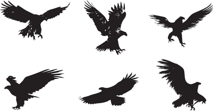 Flock of black vultures flying in dynamic motion silhouette against white background minimalist wildlife concept
