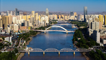 Lanzhou City Skyline with Yellow River Bridges and Modern Architecture © DoThi