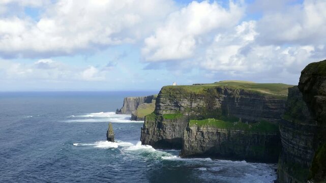 Rainbow over the famous Cliffs of Moher, tourist viewing location of spectacular sea cliffs in the Burren region of County Clare, Ireland. O'Brien's Tower visible.