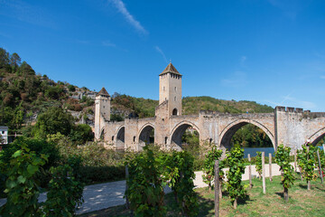 Fototapeta premium Valentré Bridge in Cahors crossing the Lot River, medieval architecture in France