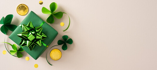 A green gift box with a shiny bow, shamrock decorations, and gold coin accents creates a festive...