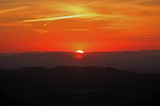 Sunset as seen from the NSF Kitt Peak National Observatory in the Sonoran Desert, near Tucson, Arizona, USA on I&rsquo;oligam Du&rsquo;ag or Manzanita Bush Mountain in the Quinlan Mountain range within the Tohono