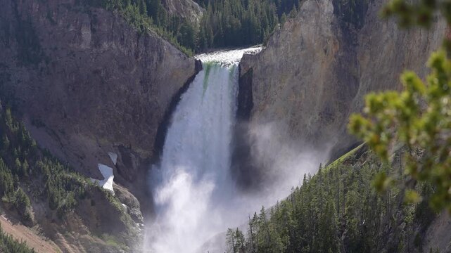 Beautiful shot of the Lower Falls in Yellowstone National Park, Wyoming, showcasing the massive and majestic waterfall surrounded by rugged canyon walls