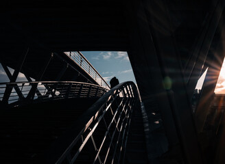 silhouette of a person in a dark tunnel