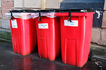 Wheelie bins in row for refuge collection outdoors