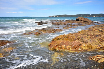Coastal rocky reef in Jones Bay with Kawau Island in background. Location: Auckland New Zealand