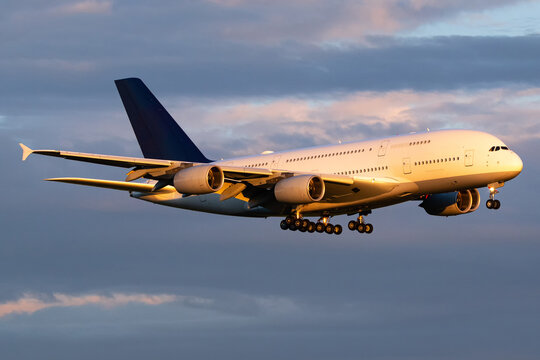 airplane at the airport landing beautiful sunset dramatic sky bright colours planespotting