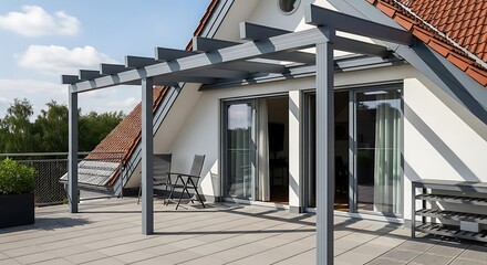 Obraz premium Rooftop patio with pergola, overlooking a vista of trees and red tiled roof