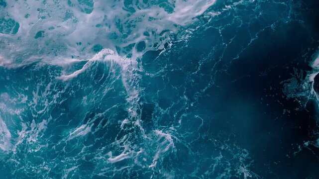 Abstract aerial view of rough ocean waves forming natural water patterns