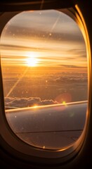 Fototapeta premium View sky from an airplane window as the sun sets behind the.