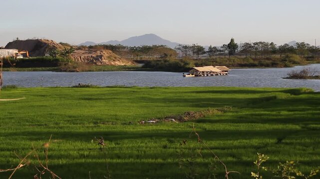 Sunset over Vo Xu River in Dong Nai Viet Nam Mother and Daughter in Rural Sence among green feild windy afternoon with bird singing background sound