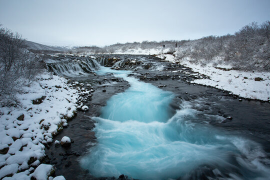 Glacial Blue Water In Black Whirlpool