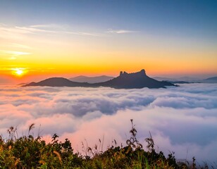 Sunrise above clouds mountain landscape view.