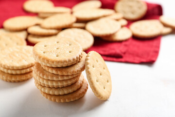 Composition with tasty crackers on marble background, closeup