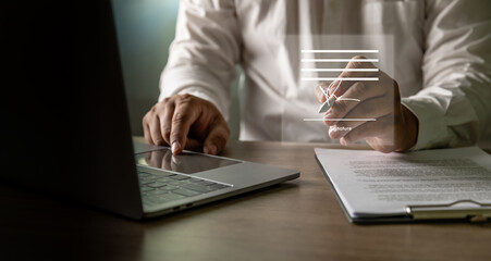 Electronic signature paperless contract concept, verified signing interface, businessman signs with a stylus on laptop beside printed documents, legal paperwork