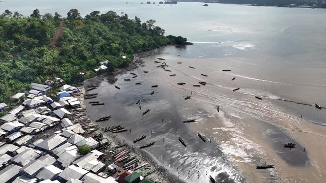 aerial footage showing the intersection of urban development and the volcanic coastline of Limbe, Cameroon