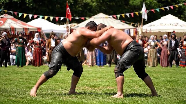 Traditional Turkish Oil Wrestling Match Outdoors.