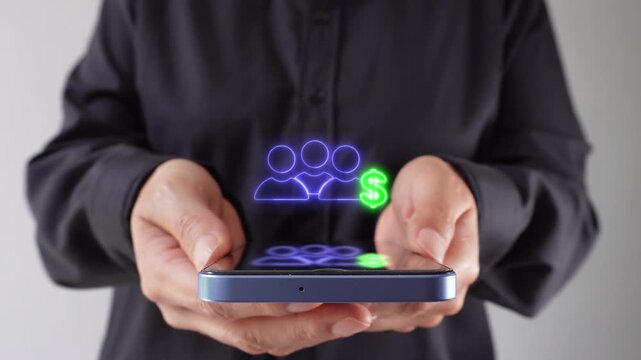 Finance in work teams. Executive holding her cell phone with a virtual group icon with a money symbol.