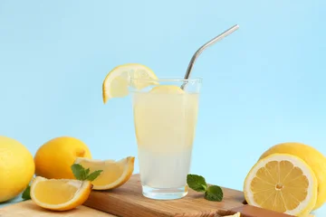 Fototapete Rund Zu Essen Glass of fresh lemonade with mint on blue background  © Pixel-Shot