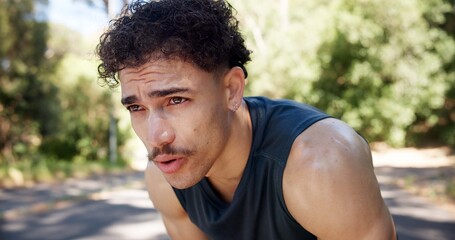 Fototapeta premium Exhausted, man and outdoor with breathing from cardio workout, exercise challenge and sports fatigue. Active person, sweat and tired in road with training break, fitness and recovery for wellness.