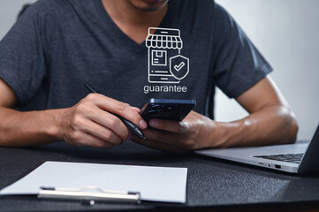Modern Workspace with Guarantee Symbol on Smartphone and Notebook