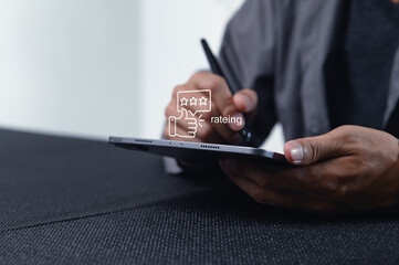User Giving Feedback with Tablet Featuring Rating Symbol on Screen