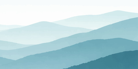 Obraz premium A serene morning mist blankets the blue mountain range as clouds drift over a silhouette of forest hills at sunrise, creating a breathtaking nature landscape view of the valley at dawn