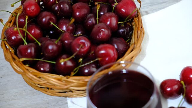 Ginja de Obidos, traditional sour cherry liquor. Homemade tincture of red cherry. Berry alcoholic drinks.  Early richmond cherry.  Sweet brandy.