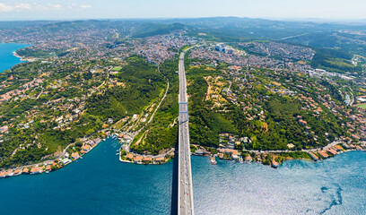 Istanbul, Turkey. Aerial perspective of FSM Bridge crossing Bosphorus Strait in clear summer weather. Aerial view © Video Render