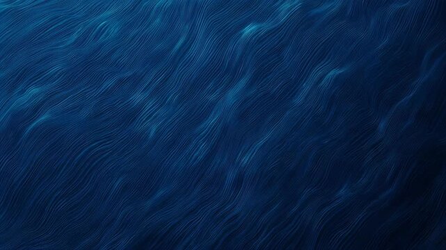 Deep blue, wavy, textured surface with intricate parallel lines creating a flowing visual