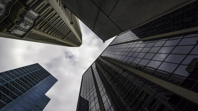 Sky and clouds reflecting over skyscrapers facades in Financial District in New York City, 